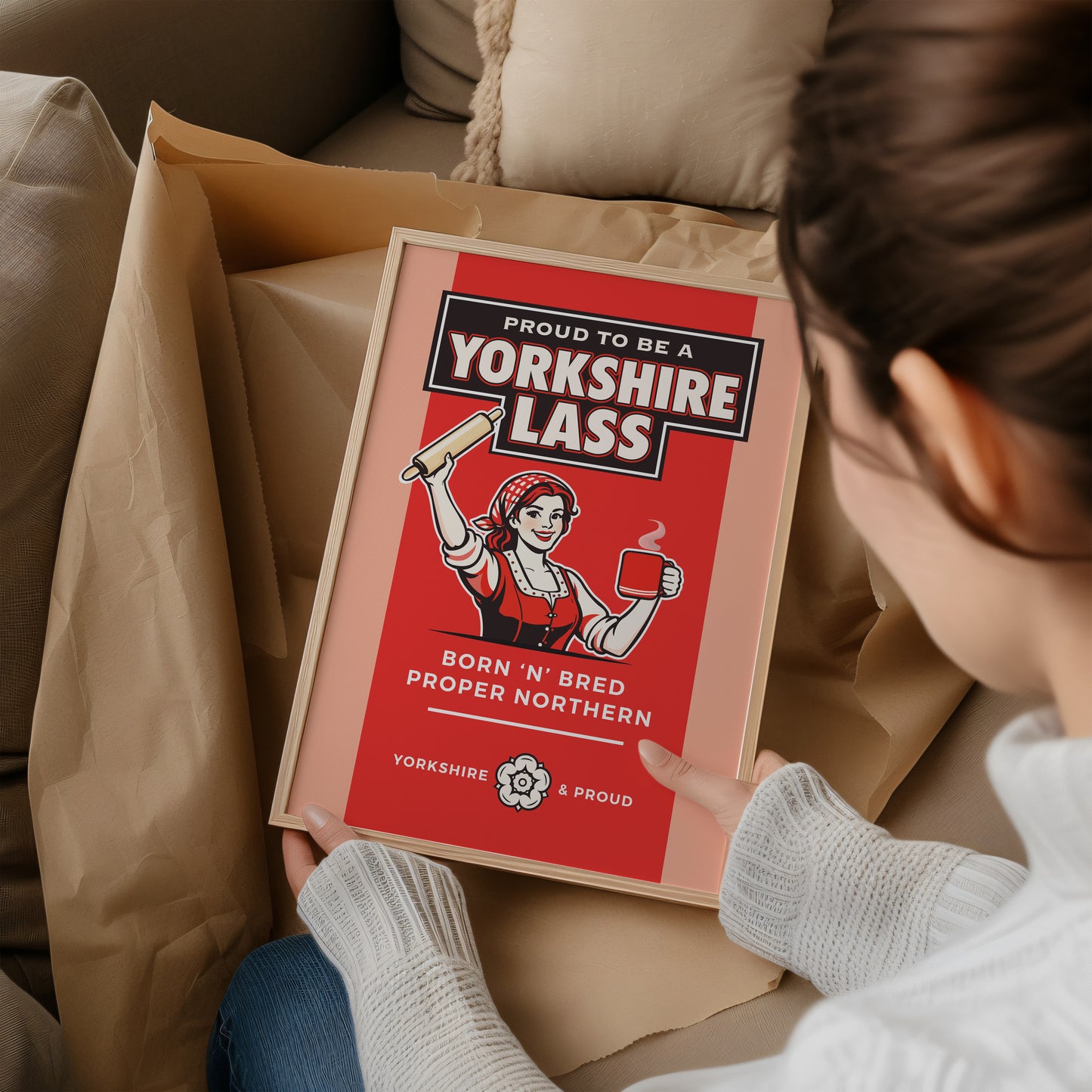 Person holding a framed print with 'Proud to be a Yorkshire Lass' design.